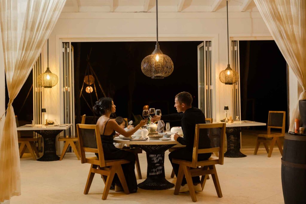 Intimate romantic dinner for two at the Paddle House Beachfront Restaurant overlooking the Caribbean Sea at The Lodge at Jaguar Reef, Hopkins, Southern Belize